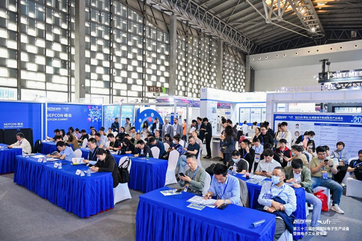 A group of people sitting at tables in a room AI-generated content may be incorrect.